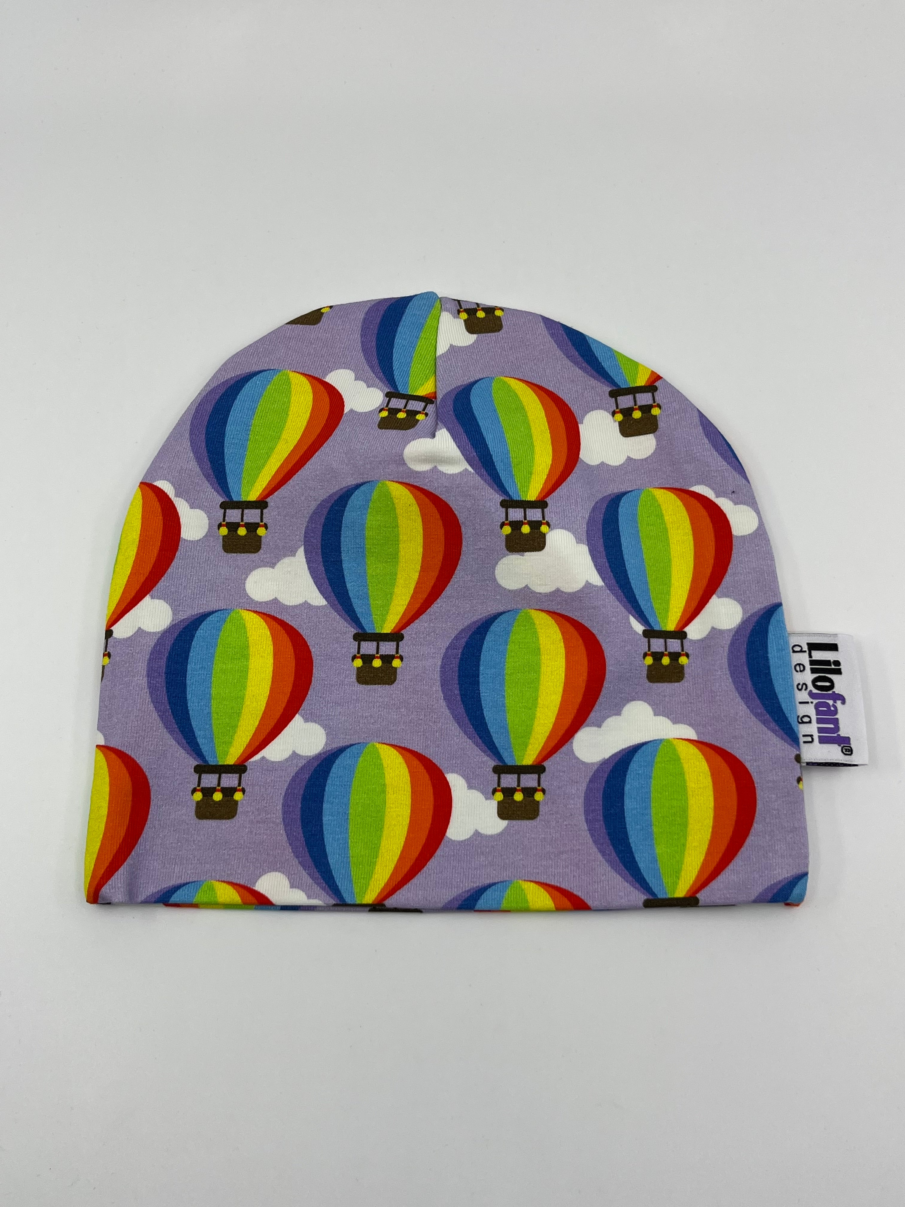 Lila luftballonger mössa