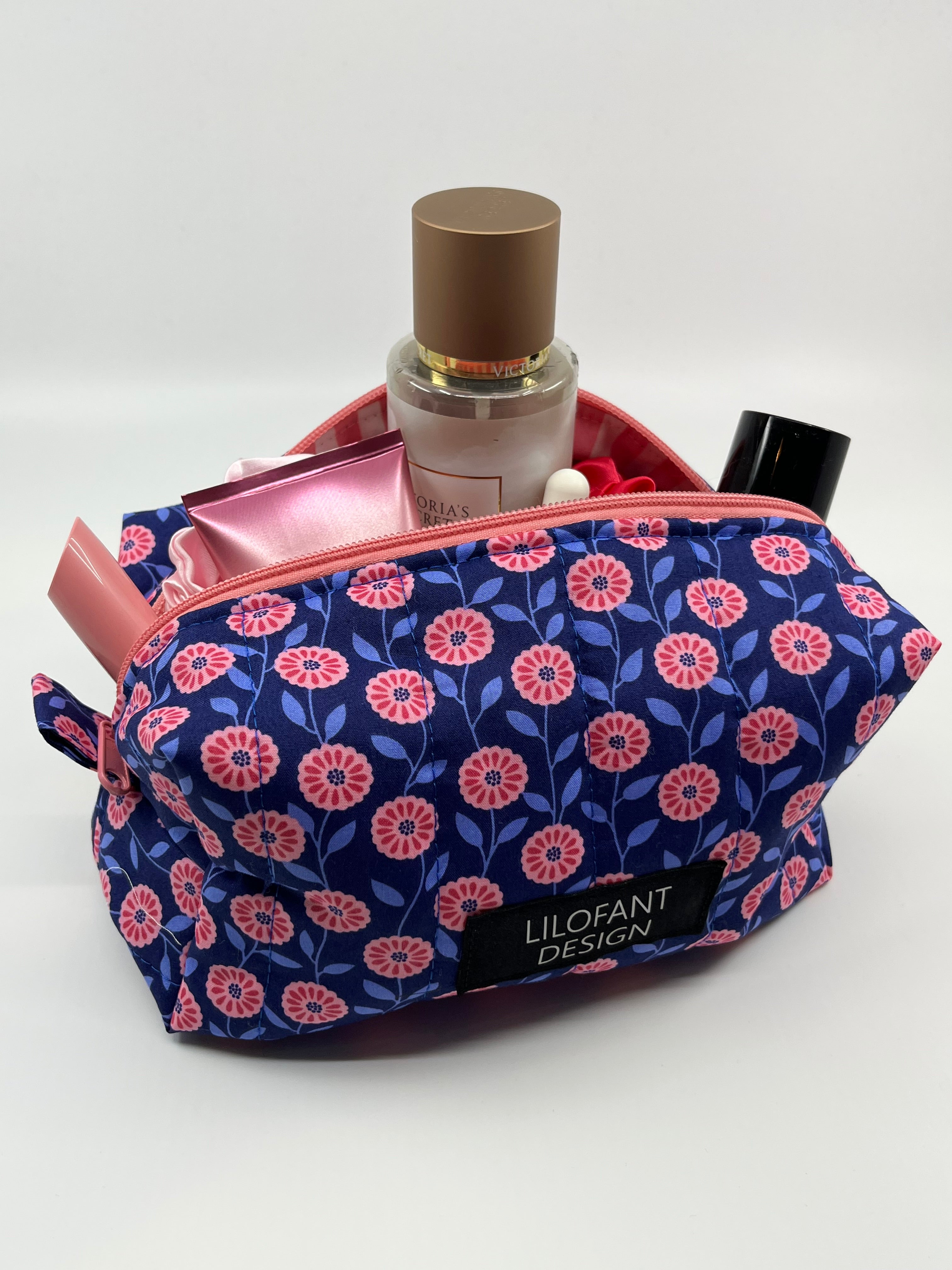 Blå med rosa blommor necessär