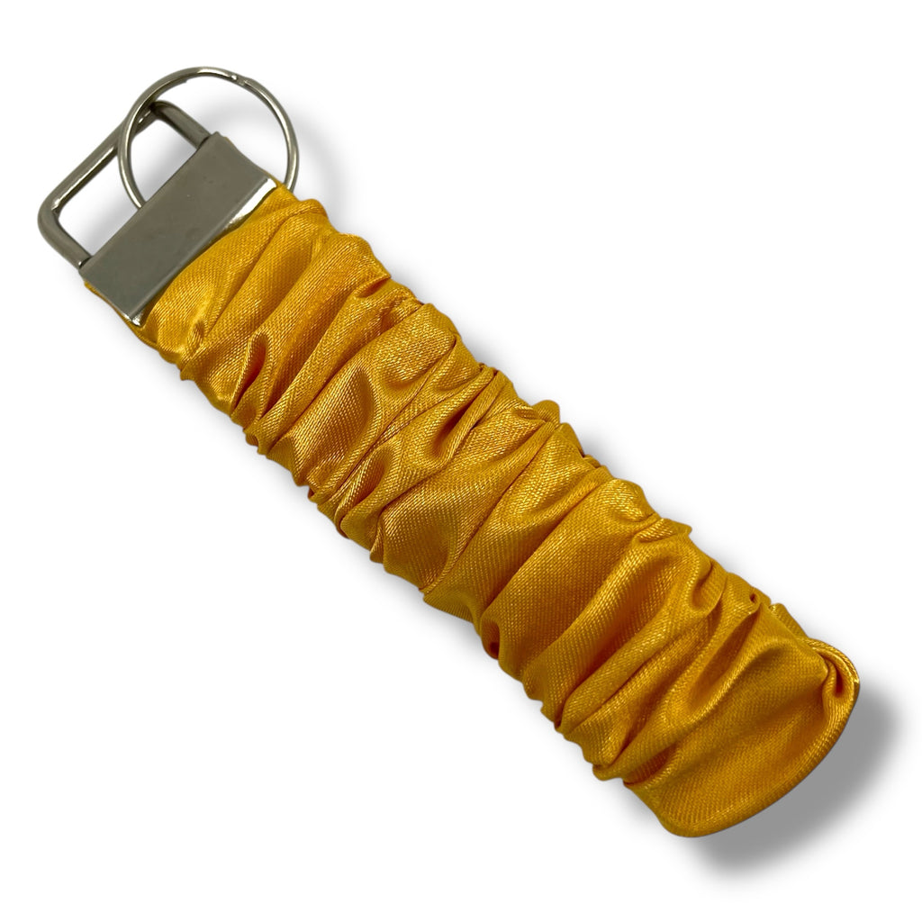 solgul scrunchie nyckelring