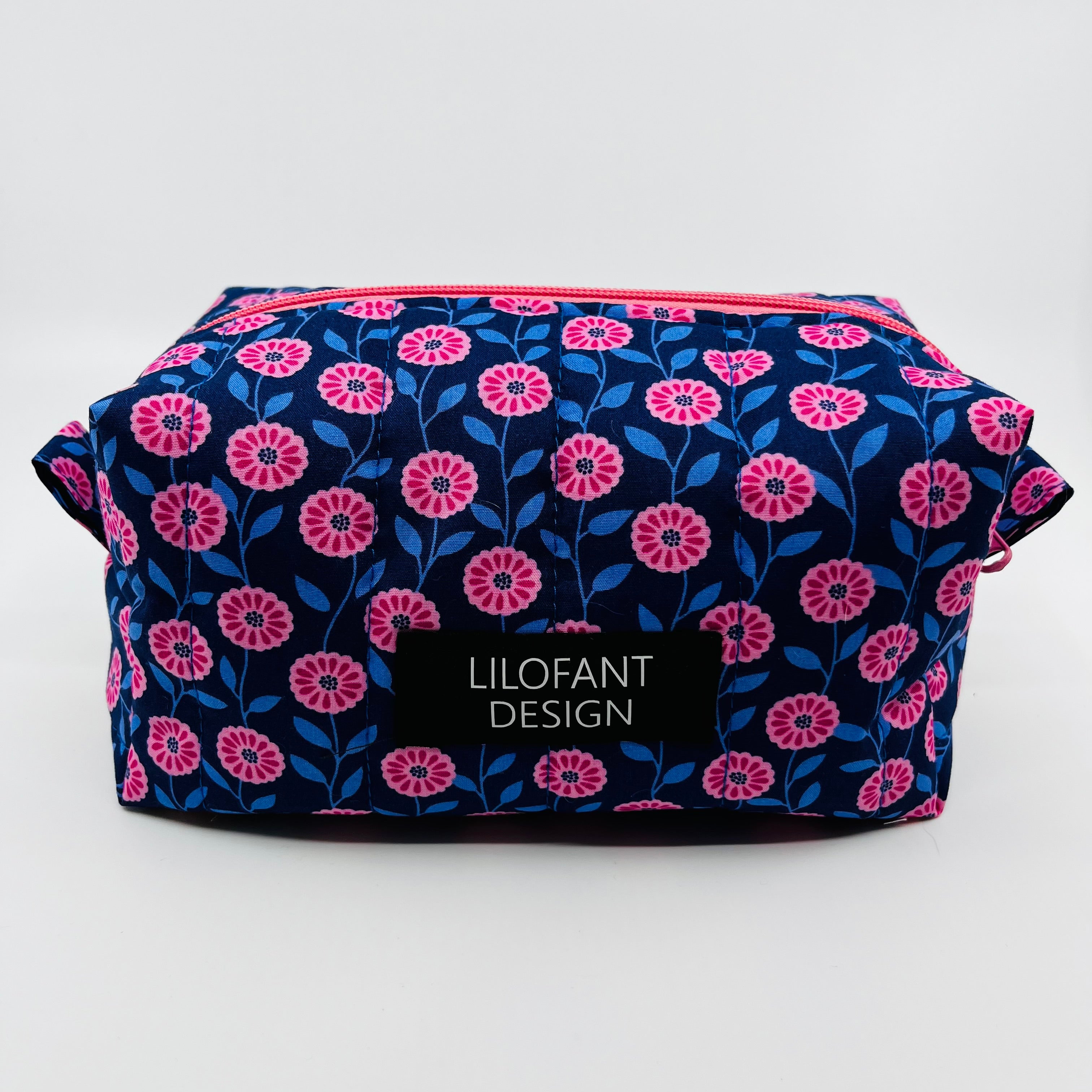 Blå med rosa blommor necessär