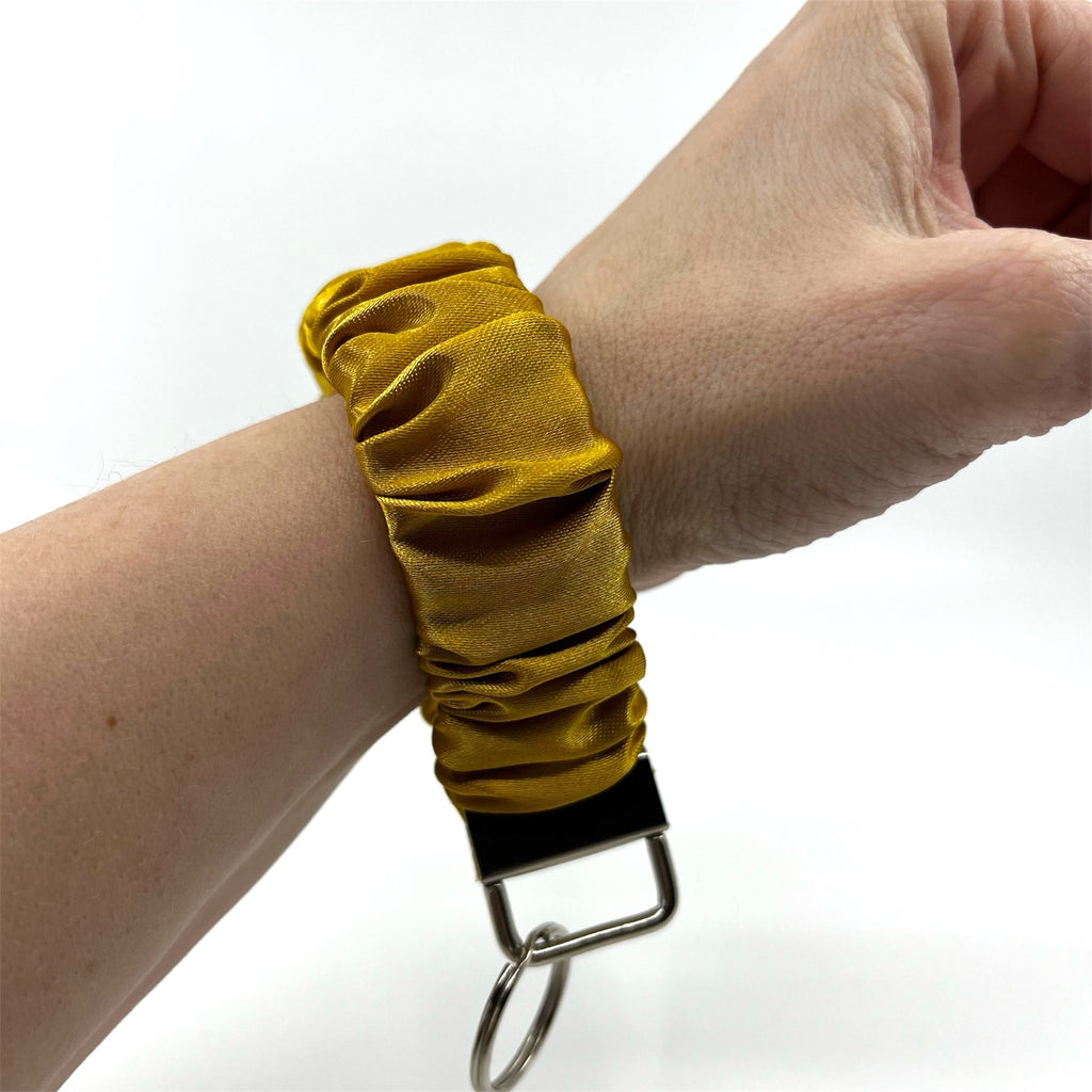 Guld scrunchie nyckelring