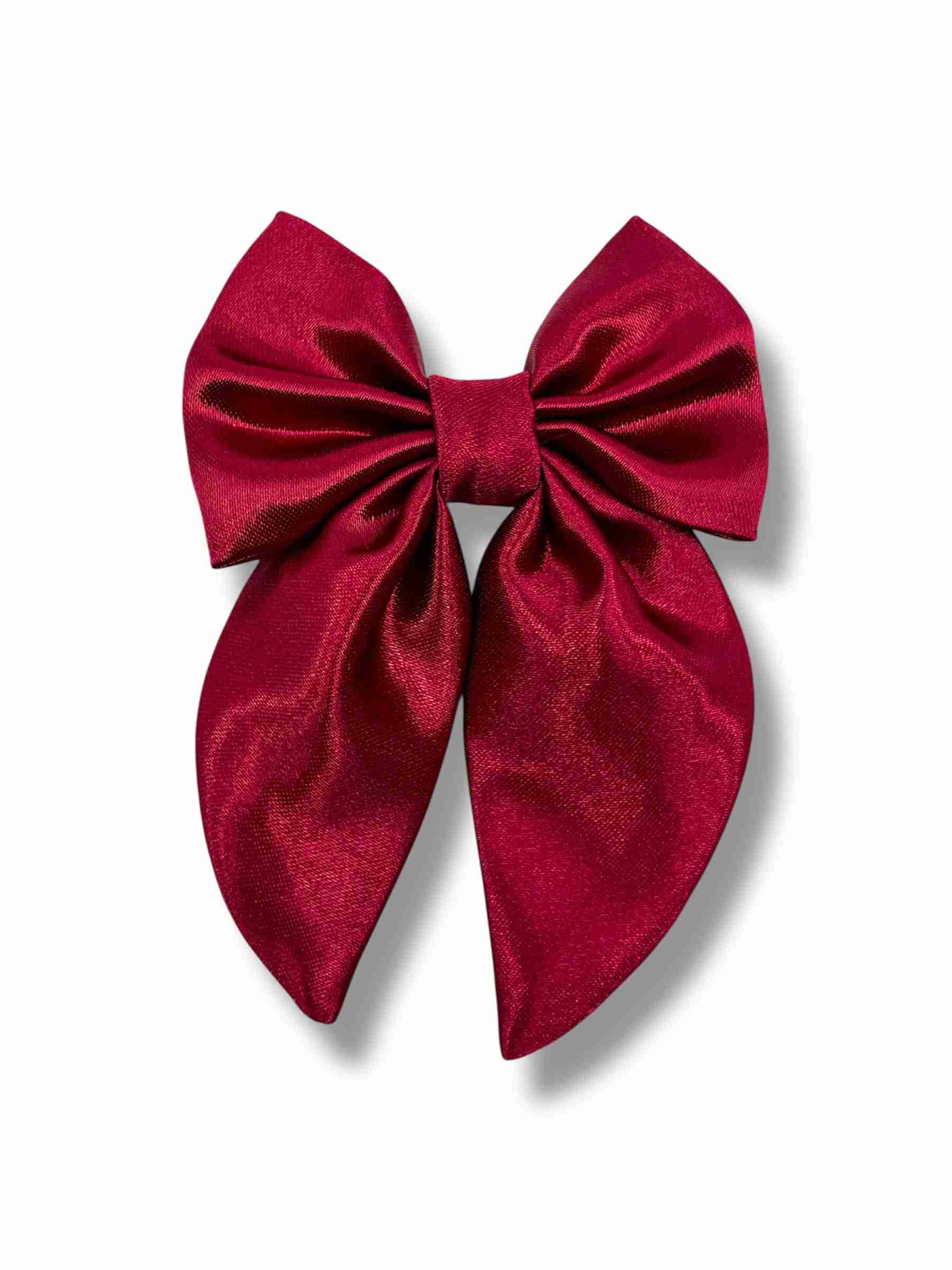 Mörkrosa hårspänne med rosett i satin