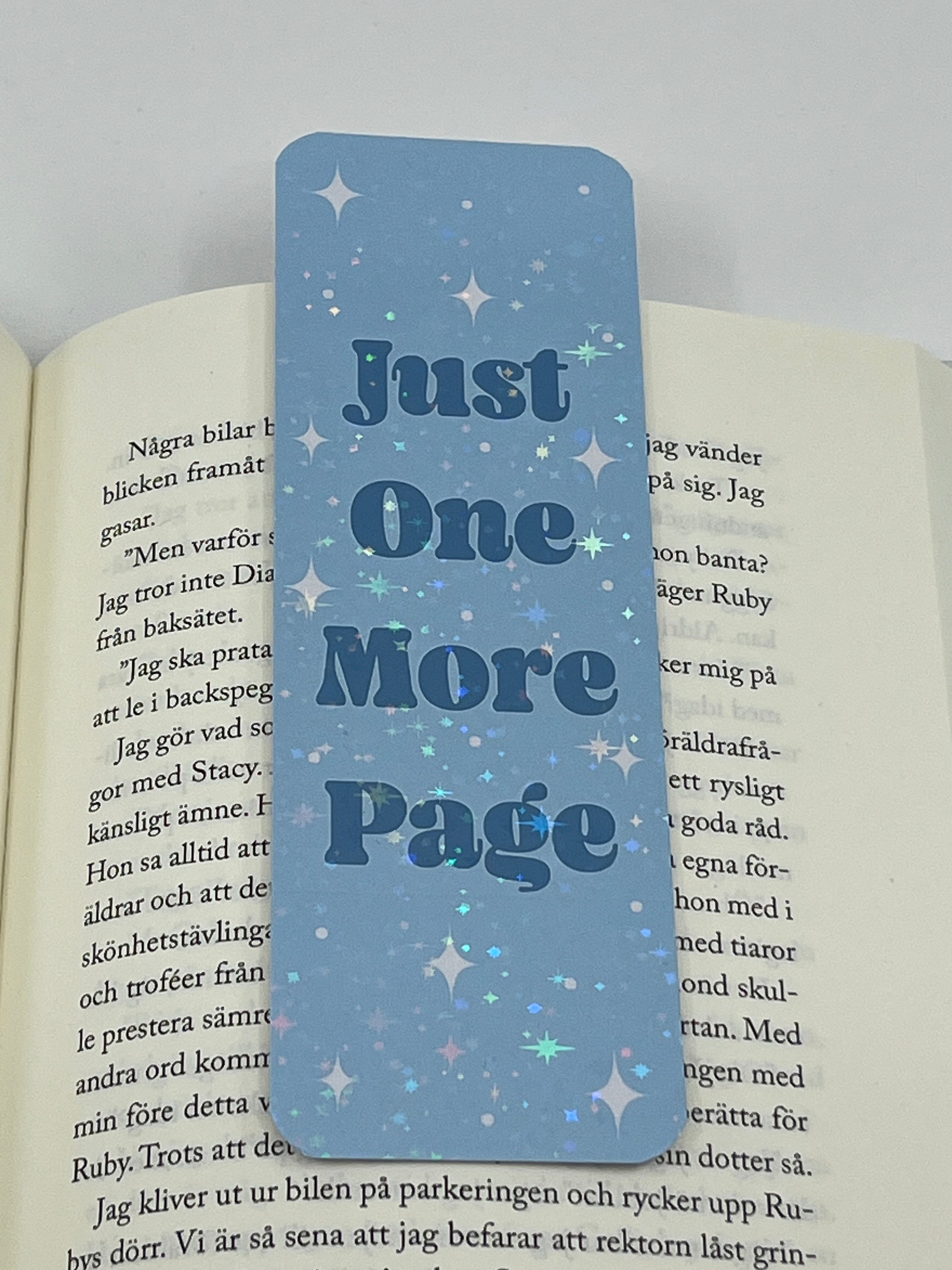 Blå just one more page bokmärke